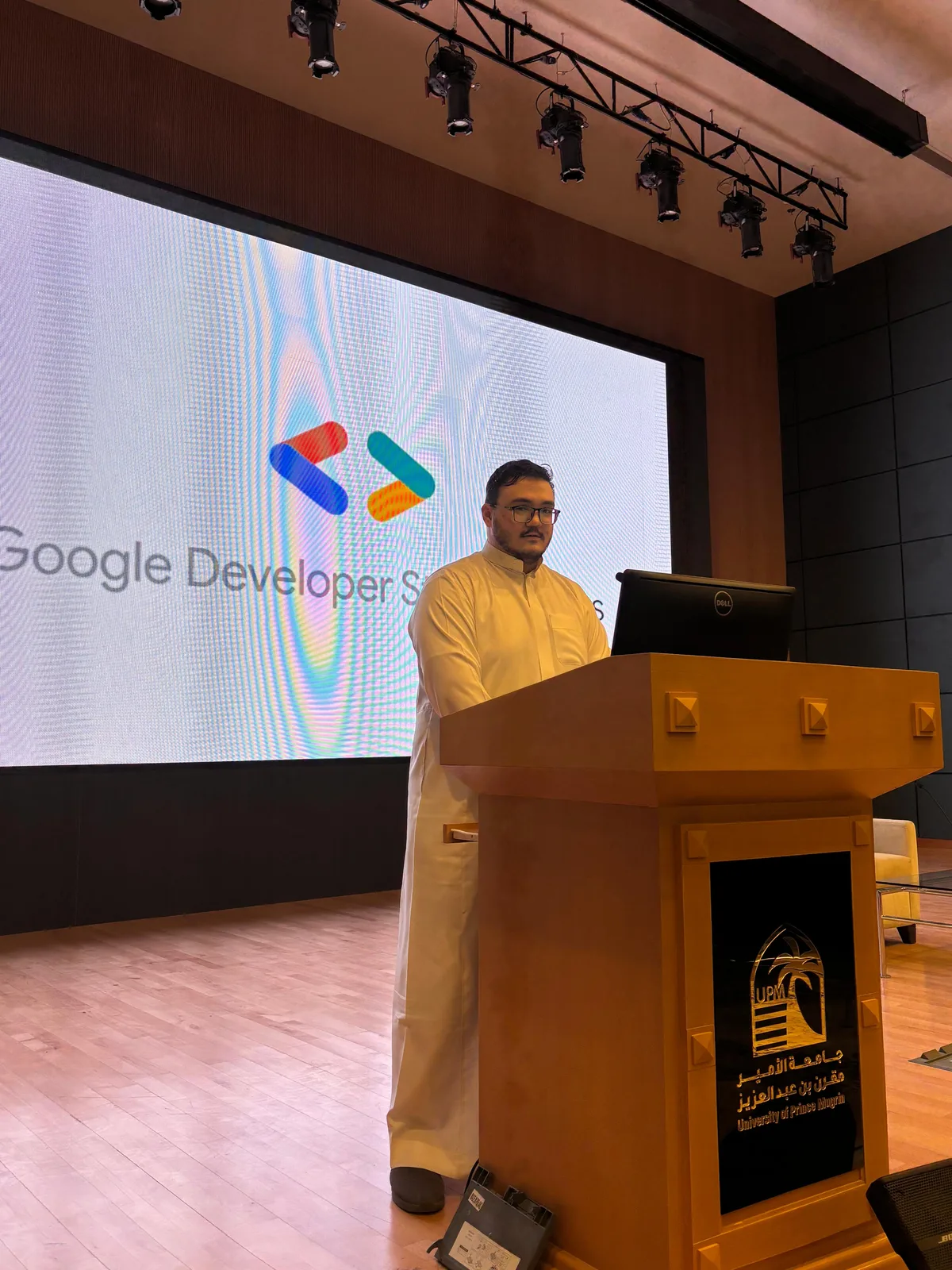 Salem at the university podium during a GDSC event